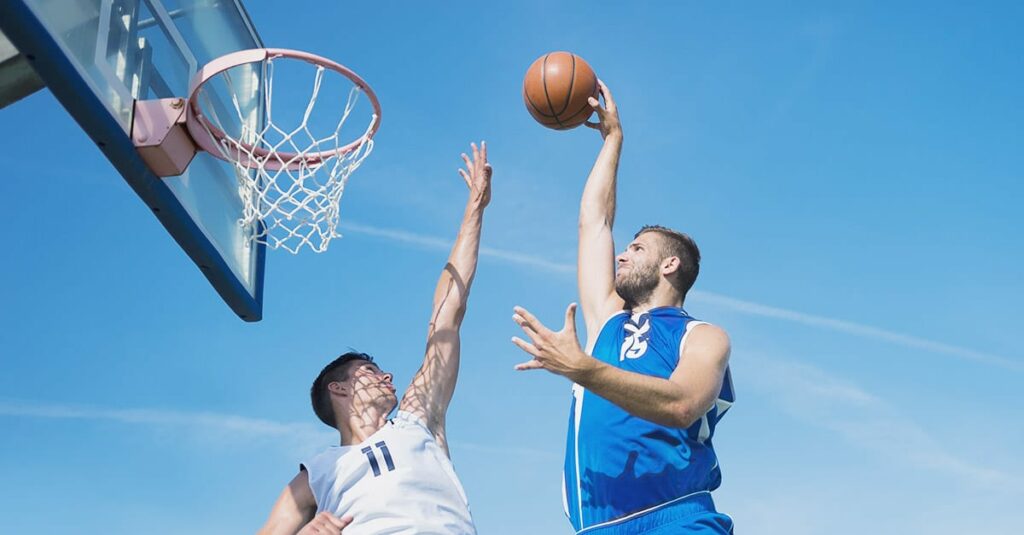 Basketball action in mid air