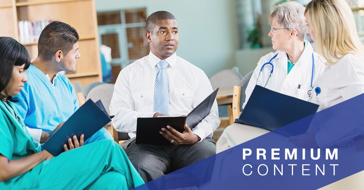 Hospital nurses, doctors, and administrators having healthcare staff meeting