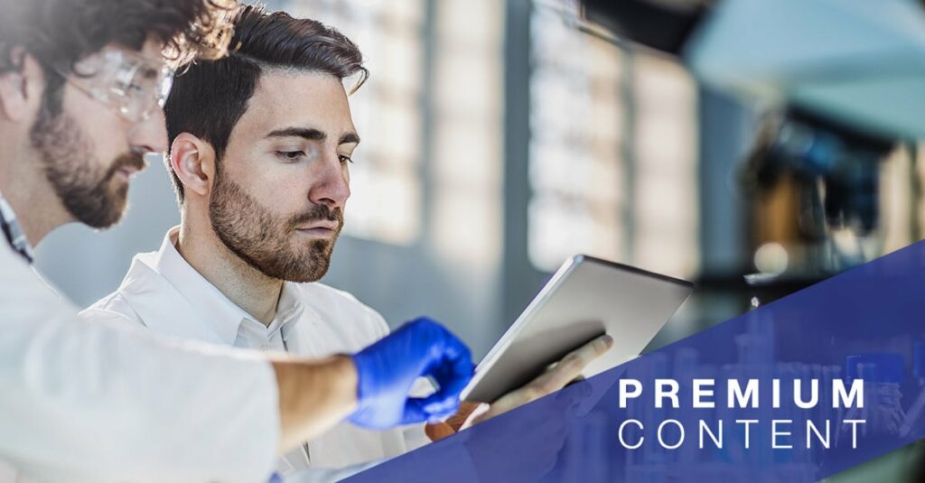 Two scientist using digital tablet in laboratory