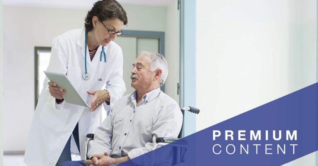 Doctor is chatting with a patient on a wheelchair.