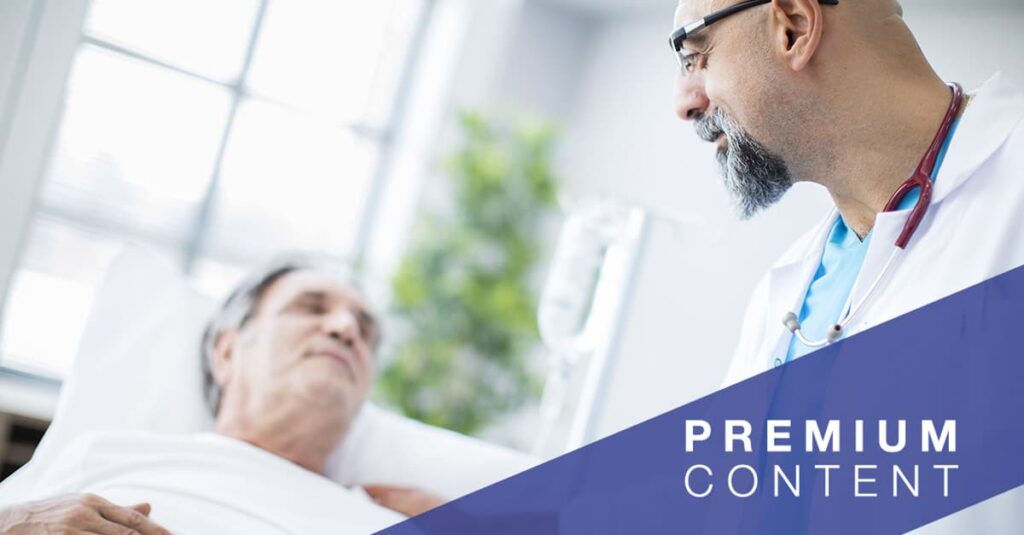 Doctor talking to patient in hospital bed