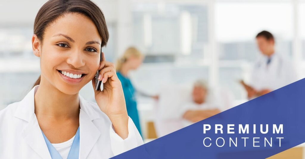 Female doctor holding cellphone with colleagues and patient in background