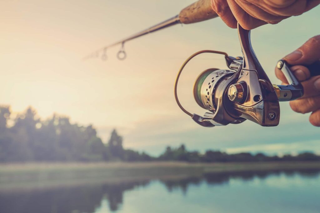 Person reeling in with a fishing rod