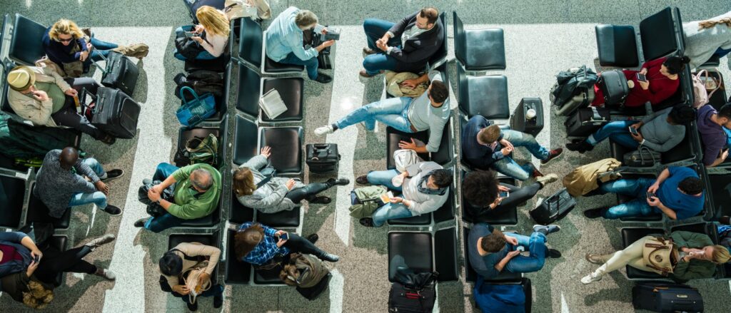 Overhead view of customers in airport waiting area