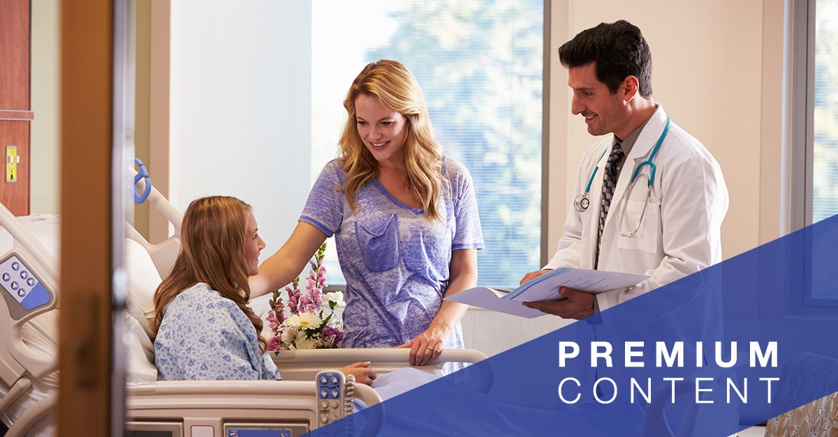 Doctor and nurse speaking with patient in hospital