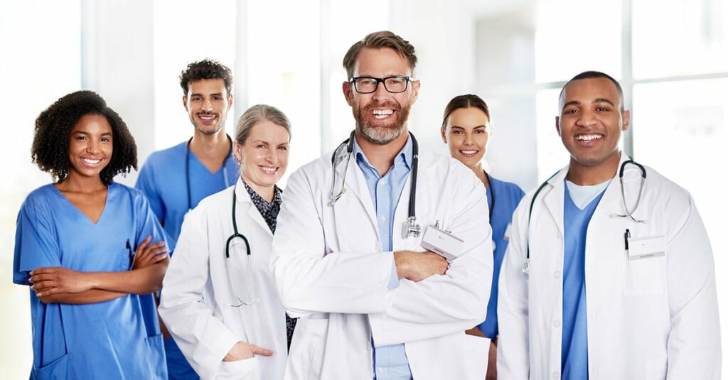 Doctor and medical staff standing together