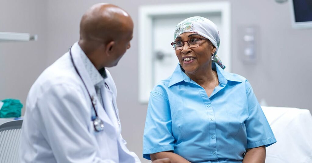 Patient and doctor speaking during radiation oncology appointment