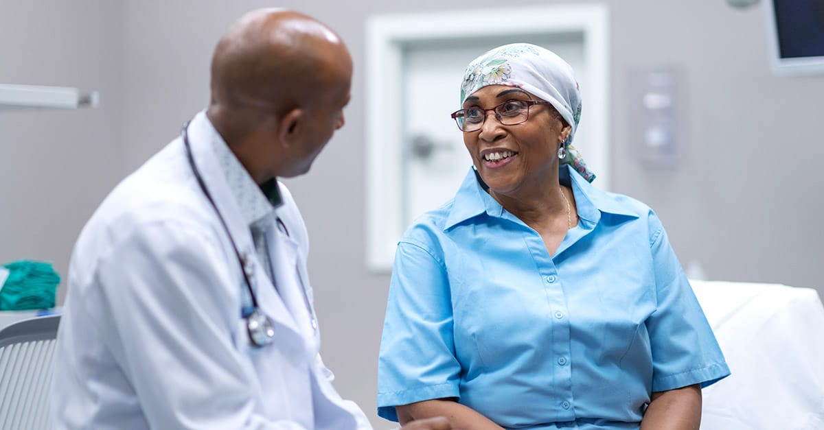 Patient and doctor speaking during radiation oncology appointment