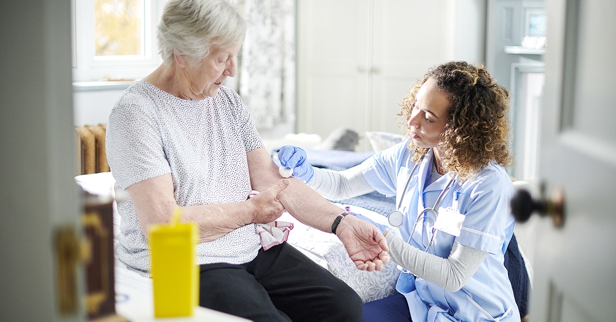 Healthcare worker caring for elderly patient