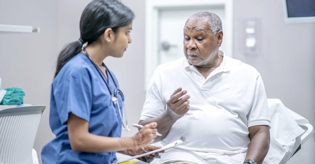 Female doctor treating African American patient