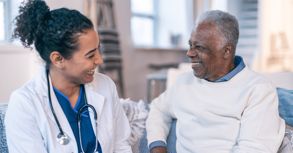 Doctor speaking to patient in office