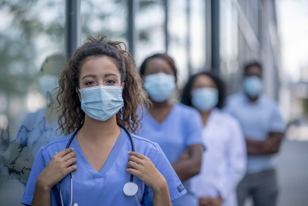 Doctor and care team in masks