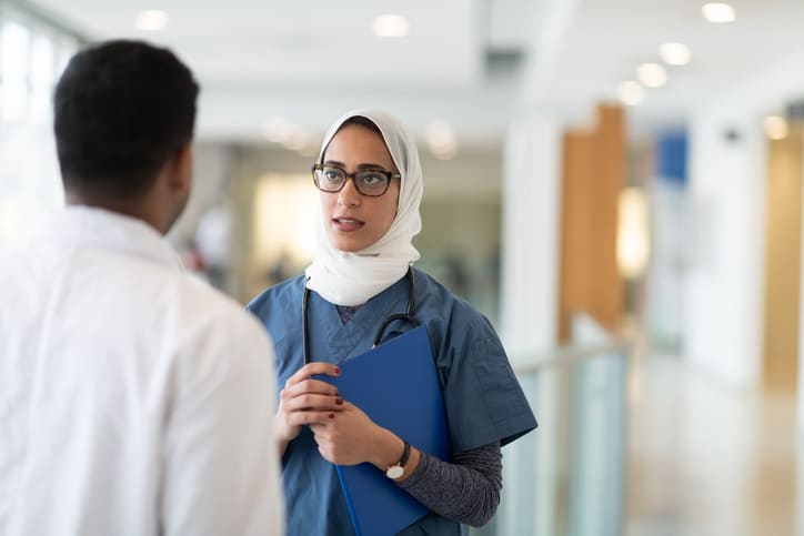 Doctors discussing treatment in a hospital.