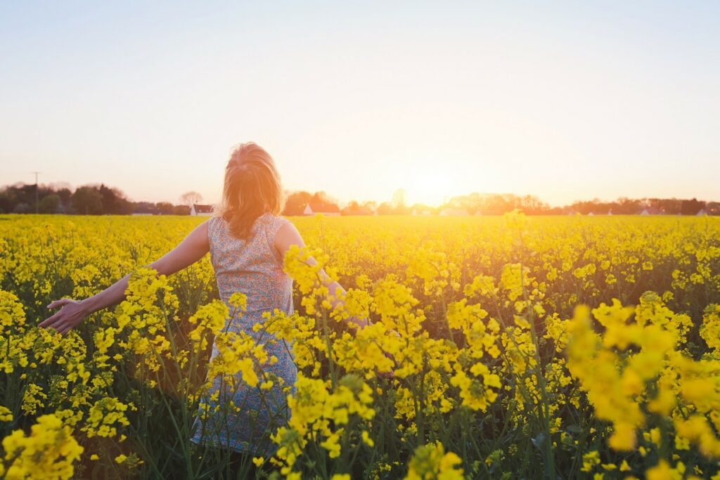 Woman in field of flowers