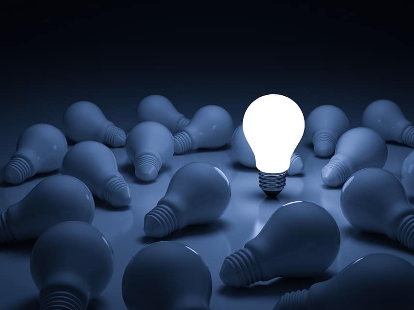 One glowing light bulb standing out from the unlit incandescent bulbs with reflection , leadership and different creative idea concept. 3D rendering.