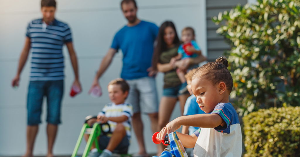 Family playing in driveway