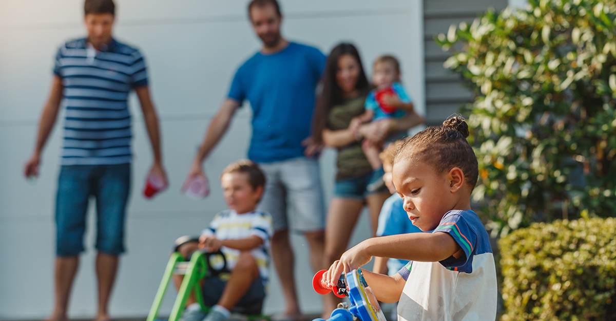 Family playing in driveway