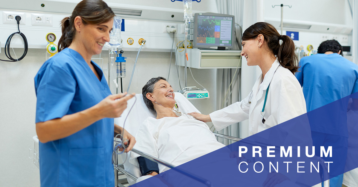 Care team speaking with patient in hospital bed