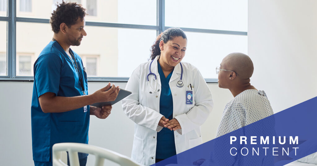 Patient speaking with doctor and nurse in hospital