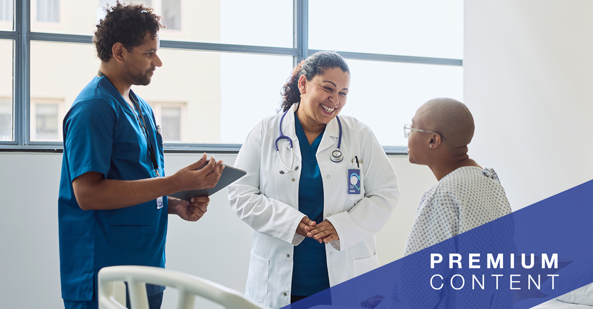 Patient speaking with doctor and nurse in hospital