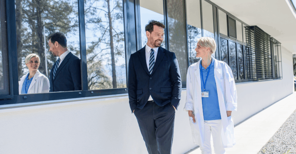 healthcare executive speaking with physician