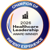 Circular award badge saying '2026 Healthcare Leadership Award Winner' with 'Champion of Patient Experience' around the edge and a small hospital icon in the center.