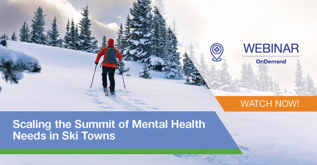 Person on skis traveling up a mountain.